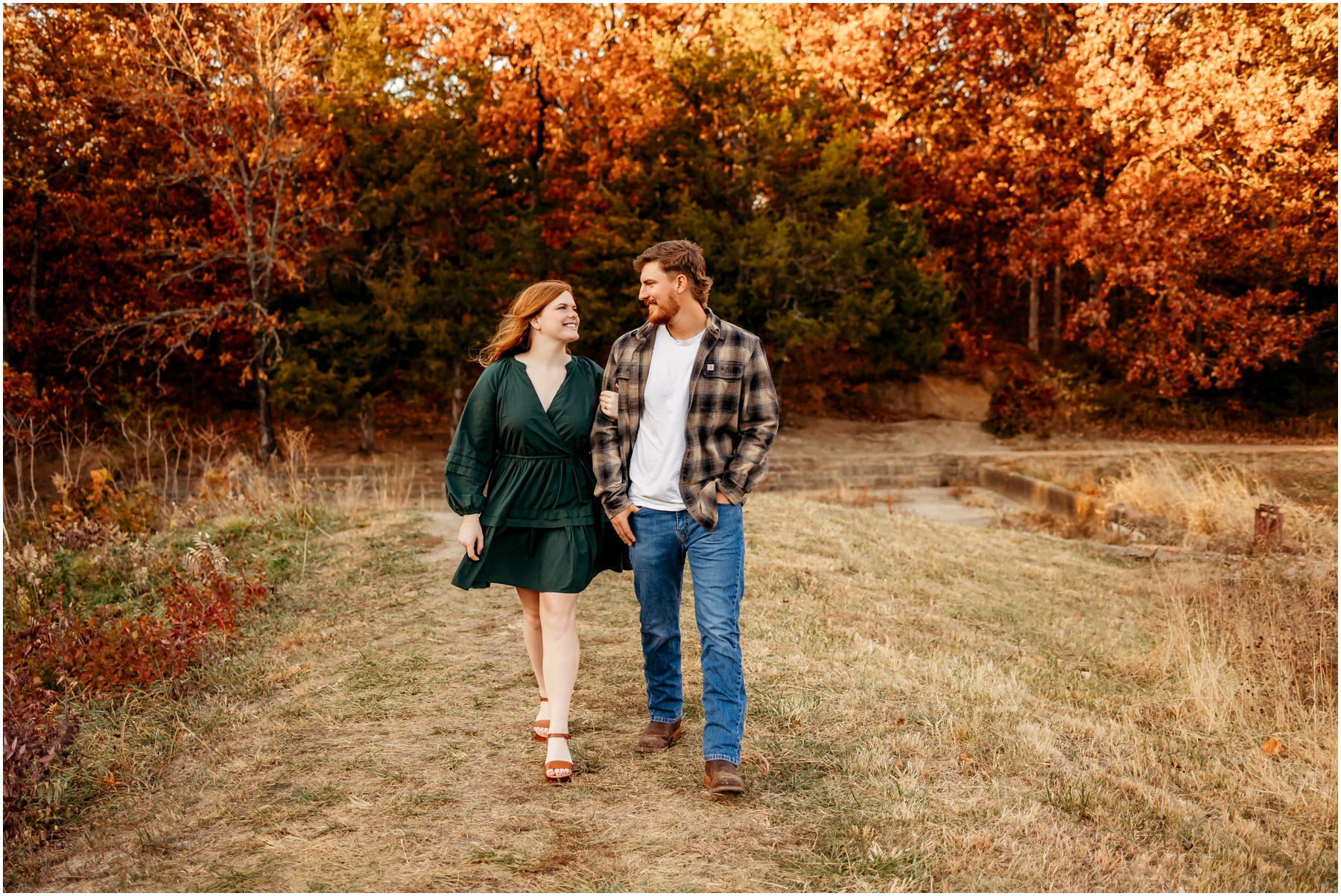 Faith and Stephen during their fall engagement session at Knob Noster State Park with Brittany Jewell Photography, surrounded by vibrant autumn foliage and scenic landscapes.