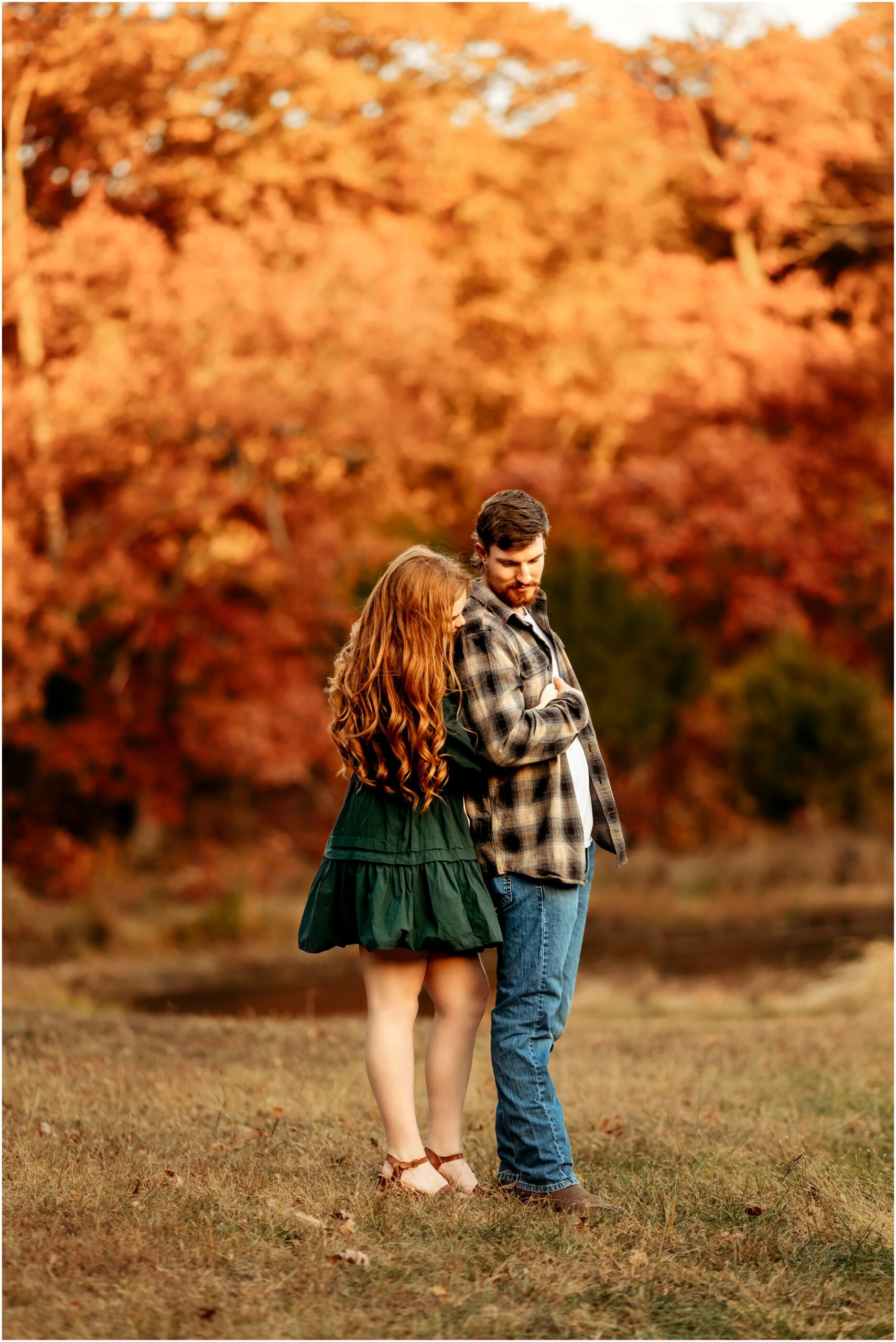 Faith and Stephen during their fall engagement session at Knob Noster State Park with Brittany Jewell Photography, surrounded by vibrant autumn foliage and scenic landscapes.