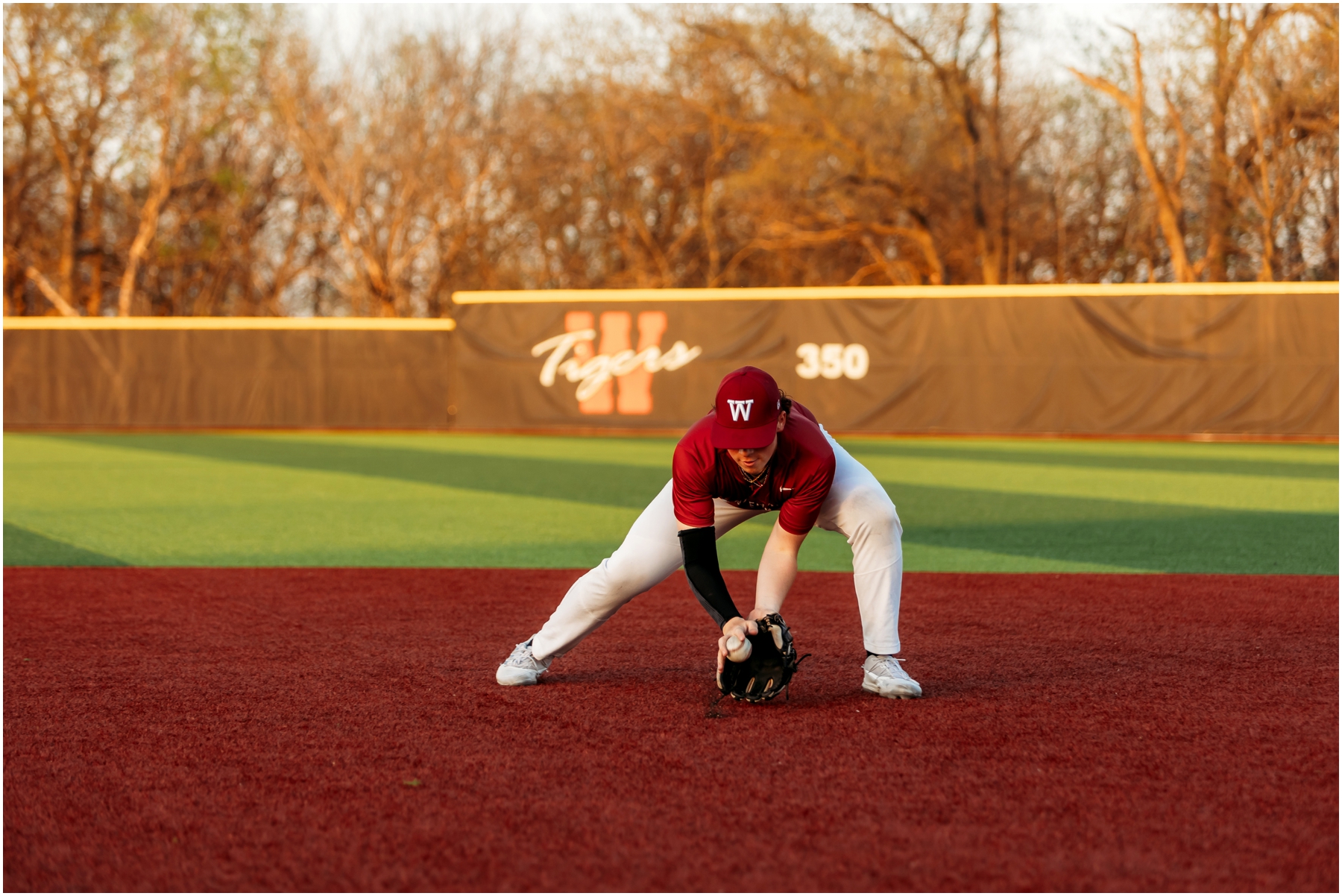 Warrensburg senior portraits of Ryan, featuring a blend of natural and sports settings with creative lighting effects, captured at Pertle Springs and WHS Baseball Field.