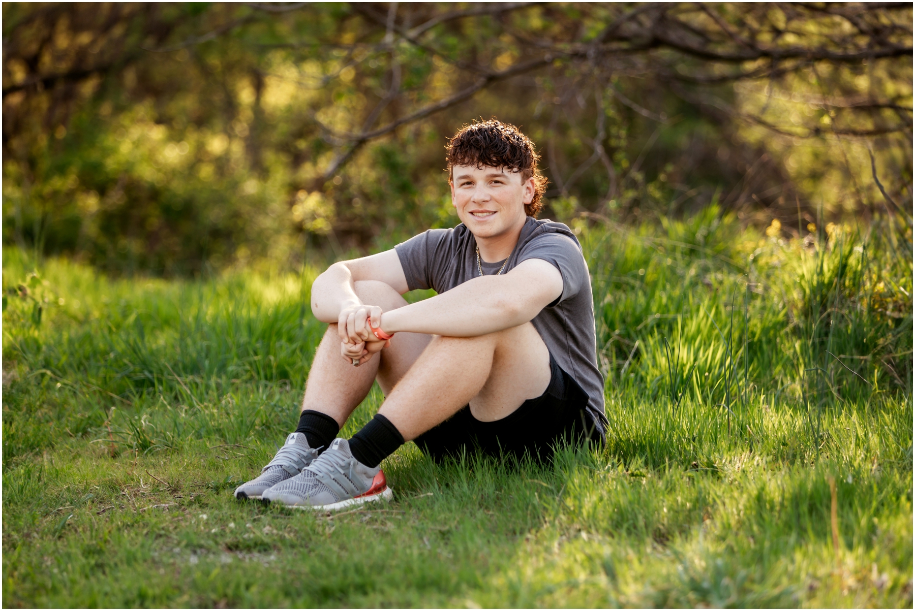 Warrensburg senior portraits of Ryan, featuring a blend of natural and sports settings with creative lighting effects, captured at Pertle Springs and WHS Baseball Field.